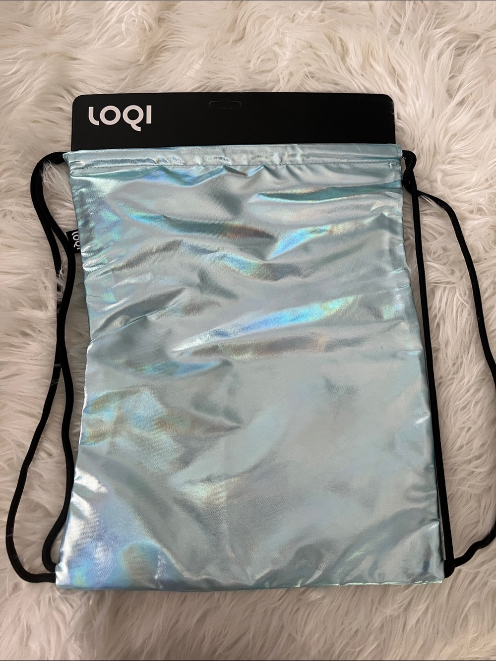 Light weight back pack with side pocket. Shimmery blue.  New with tags.